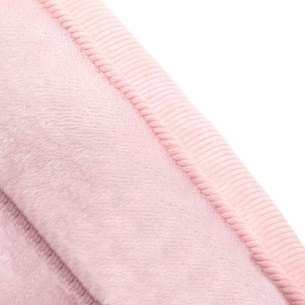 Close up of pink corduroy fabric on a pet bed