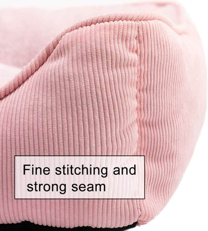 Close up of label on a pink corduroy pet bed