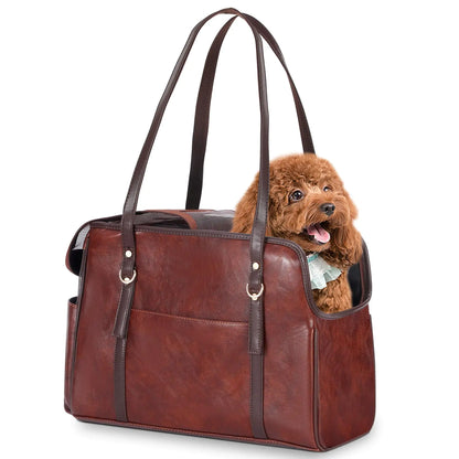 Brown leather pet carrier with a small brown dog inside on a white background