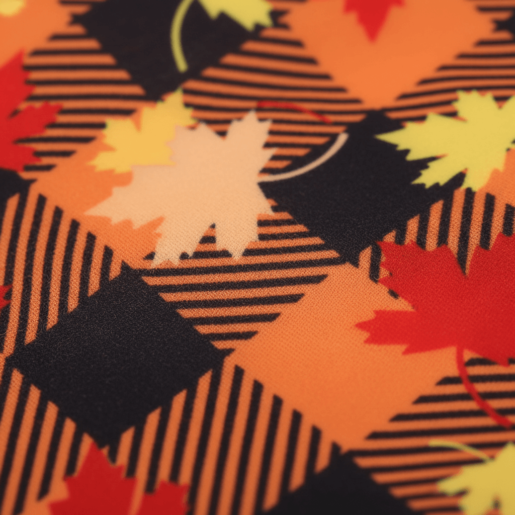 Autumn Plaid Puppy Dress – Maple Style fabric detail featuring orange and yellow maple leaves.