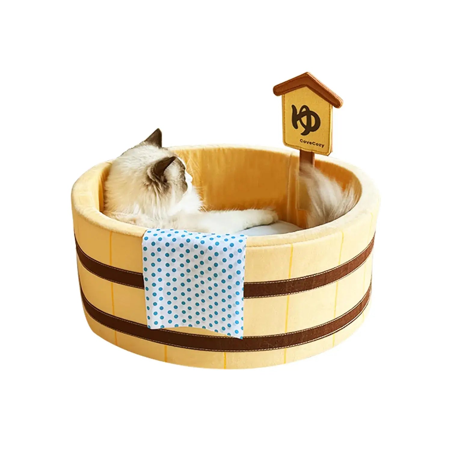 Cat resting inside japanese barrel cat bed
