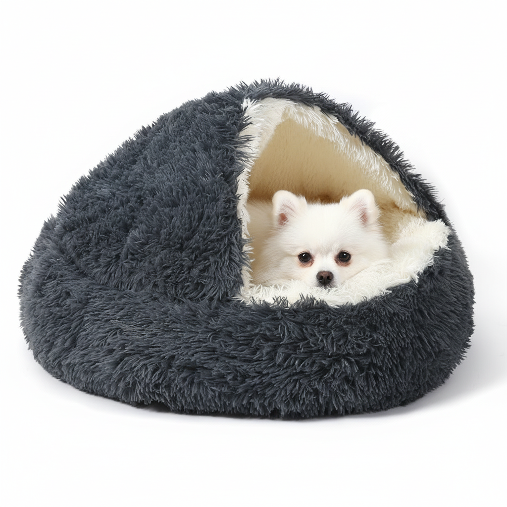 Pomeranian relaxing in hooded cave dog bed